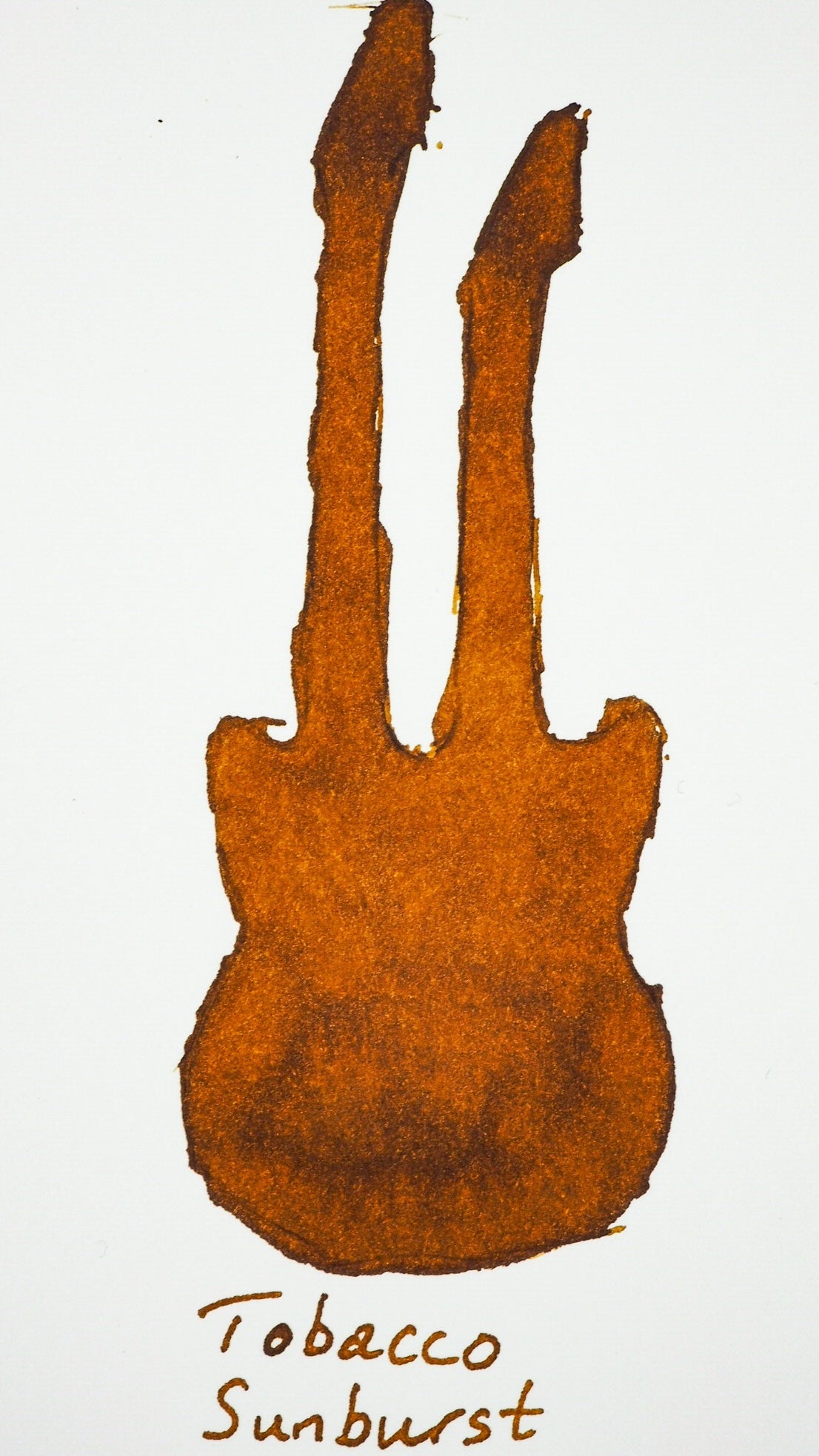 Swatch von Diamine Tobacco Sunburst in Form einer Gitarre.